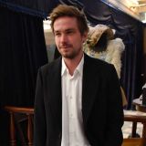 Лохматый красавец вырывался из крепких объятий Петрова